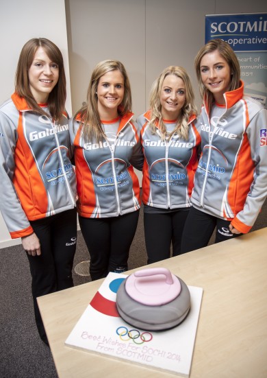 The team with their curling stone cake.